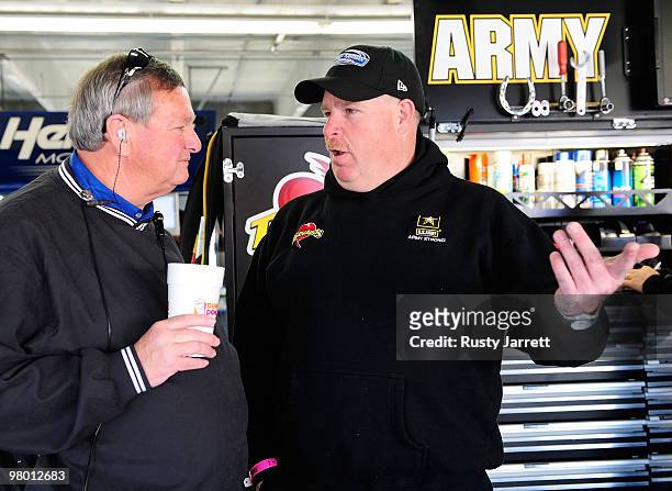 Director of Transportation Buster Auton speaks with Tony Gibson, crew chief for the Stewart Haas Racing Chevrolet, driven by Ryan Newman in the...
