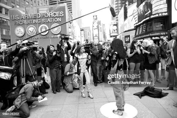 Danica Patrick poses with a lego replica of herself in Times Square in New York City on a media tour for the Indianapolis 500 on May 22, 2018 in New...