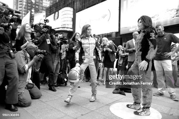 Danica Patrick pose with a lego replica of herself in Times Square in New York City on a media tour for the Indianapolis 500 on May 22, 2018 in New...