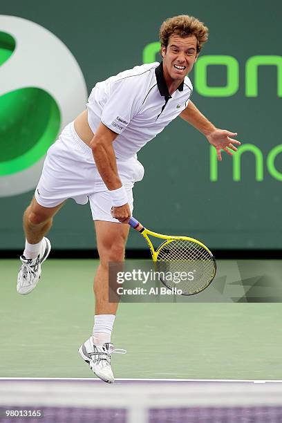 Richard Gasquet of France serves against Olivier Rochus of Germany during day two of the 2010 Sony Ericsson Open at Crandon Park Tennis Center on...