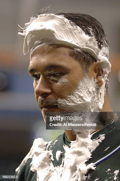 Tampa Bay Devil Rays second baseman Tomas Perez is treated to a shaving cream pie by his teammates after play against the Texas Rangers at Tropicana...