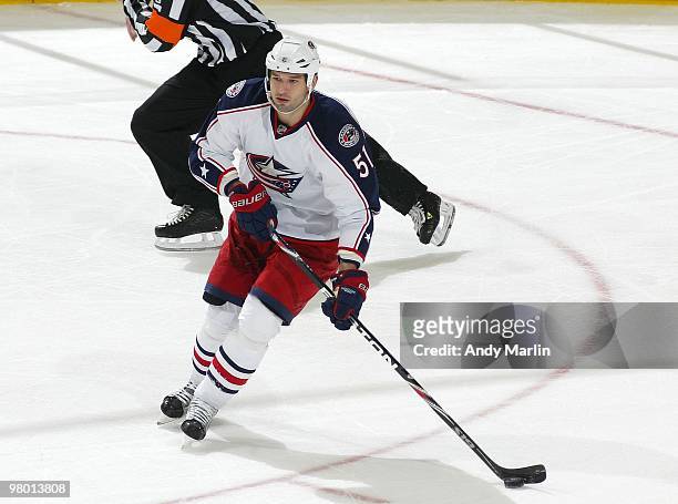 Fedor Tyutin of the Columbus Blue Jackets plays the puck against the New Jersey Devils during the game at the Prudential Center on March 23, 2010 in...