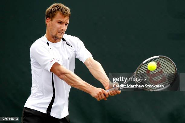 Marco Chiudinelli returns a shot against Florian Mayer of Germany during day two of the 2010 Sony Ericsson Open at Crandon Park Tennis Center on...