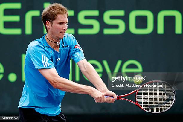 Florian Mayer of Germany returns a shot against Marco Chiudinelli of Switzerland during day two of the 2010 Sony Ericsson Open at Crandon Park Tennis...