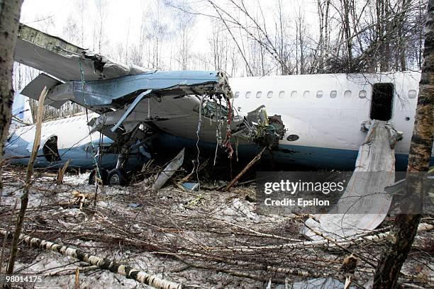 Air crash investigators and emergency personnel at the scene of a crashed Russian Tupolev TU-204 plane near Domodedovo airport on March 22, 2010 near...