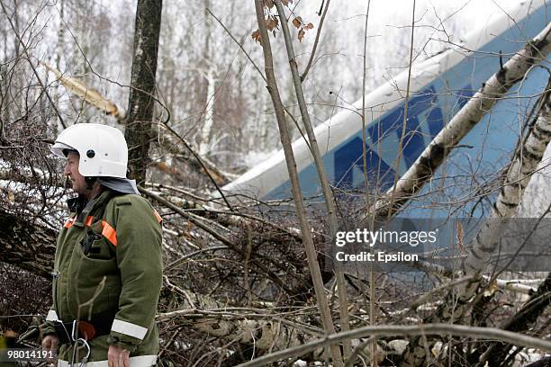 Air crash investigators and emergency personnel at the scene of a crashed Russian Tupolev TU-204 plane near Domodedovo airport on March 22, 2010 near...