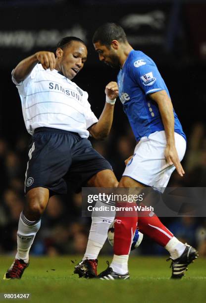 Hayden Mullins of Portsmouth challenges Didier Drogba of Chelsea during the Barclays Premier League match between Portsmouth and Chelsea at Fratton...