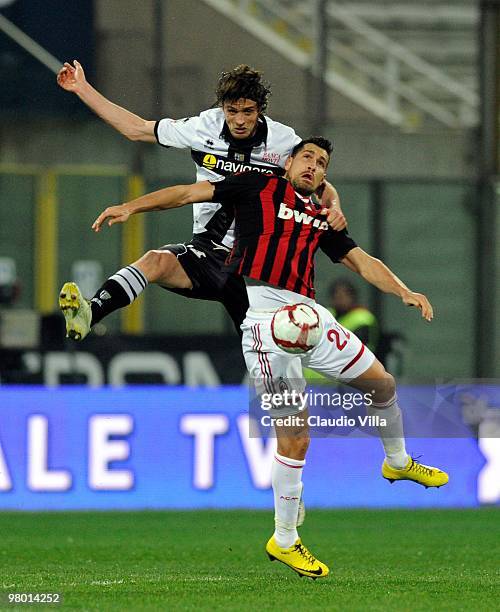 Massimo Paci of Parma FC competes for the ball in the air with Marco Borriello of AC Milan during the Serie A match between Parma FC and AC Milan at...