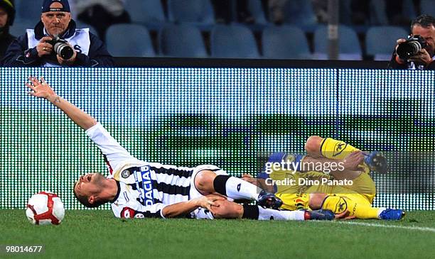 Andrea Coda of Udinese lies injured during the Serie A match between Udinese Calcio and AC Chievo Verona at Stadio Friuli on March 24, 2010 in Udine,...