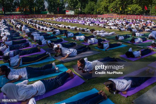 Kashmiri students perform Yoga exercise in their camp on June 21 in Srinagar, the summer capital of Indian administered Kashmir, India. Yoga, which...