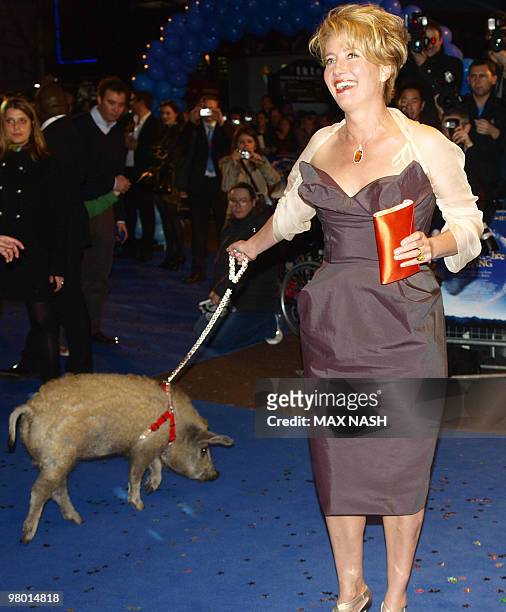 British ctress Emma Thompson keeps a pig on a leash as she arrives for the World Premiere of her latest film, 'Nanny McPhee & The Big Bang ' in...