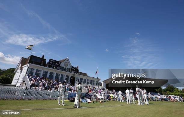 Kent batsmen Daniel Bell-Drummond and Sean Dickson wait alongside the Warwickshire team before play day two of the Specsavers County Championship:...