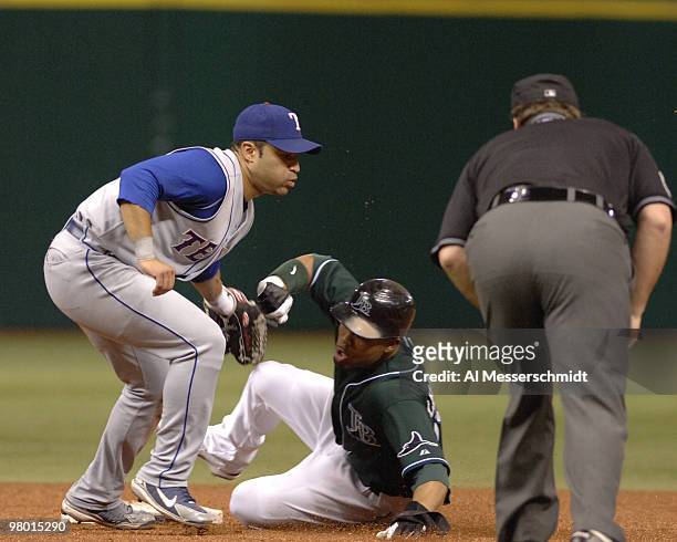 Texas Rangers shortstop Jerry Hairston tags out sliding Tampa Bay Devil Rays Carl Crawford on a steal August 22, 2006 in St. Petersburg.