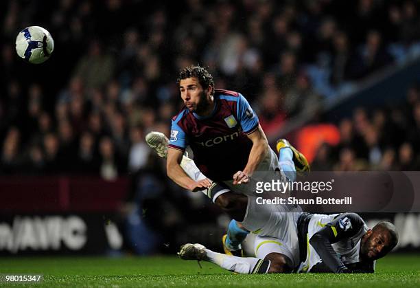 Carlos Cuellar of Aston Villa clears the ball from Darren Bent of Sunderland during the Barclays Premiership League match between Aston Villa and...