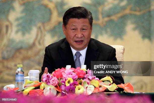 Chinese President Xi Jinping delivers his opening remarks to members of a global chief executive committee at the Diaoyutai State Guesthouse in...