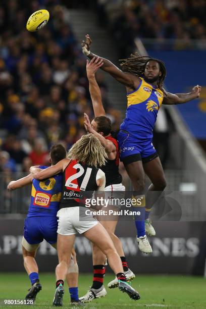 Nic Naitanui of the Eagles wins a ruck contest during the round 14 AFL match between the West Coast Eagles and the Essendon Bombers at Optus Stadium...