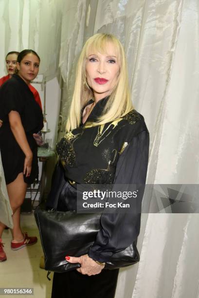 Presenter Patricia Charpentier walks the runway during the Ken Okada Street Show as part of Saint Germin des Pres Annual Feast Ð as part of Paris...