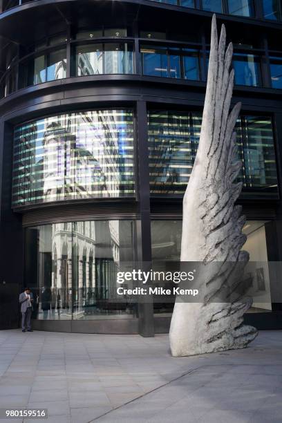 Reflected light beside The City Wing sculpture in the City of London, England, United Kingdom. Bronze sculpture by President of the Royal Academy of...