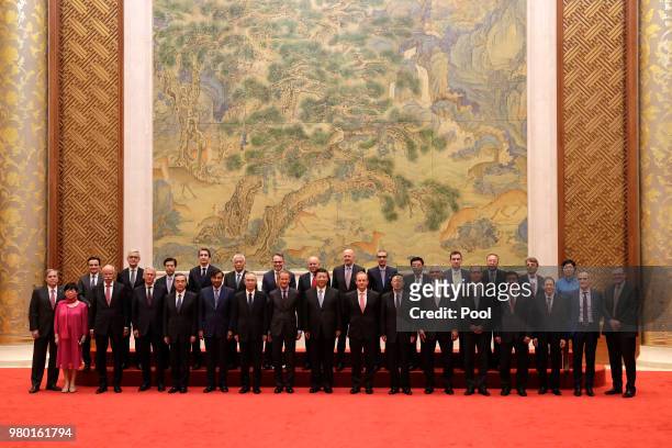 Chinese President Xi Jinping stands with members of Global chief executive committee during a group photo session for the CEO round table summit at...