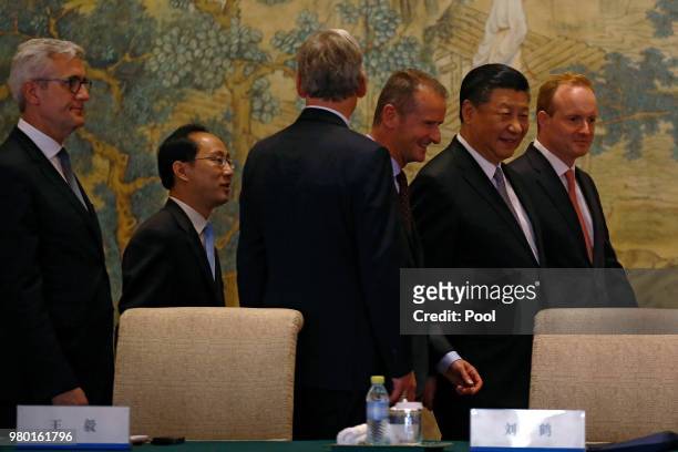 Chinese President Xi Jinping with members of Global chief executive committee as they arrive for the round table summit at the Diaoyutai State...