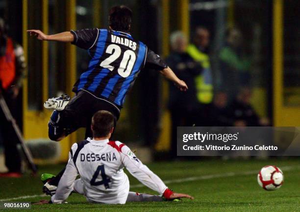 Daniele Dessena of Cagliari Calcio tackles Zapata Jaime Valdes of Atalanta BC during the Serie A match between Atalanta BC and Cagliari Calcio at...