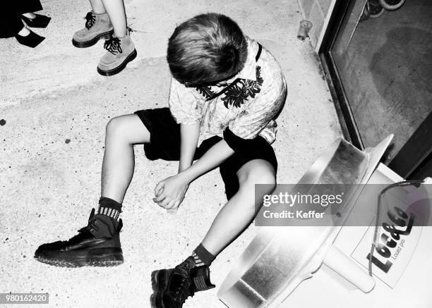 Guest attends the Raf Simons - After Party Menswear Spring/Summer 2019 show as part of Paris Fashion Week on June 20, 2018 in Montreuil, France.