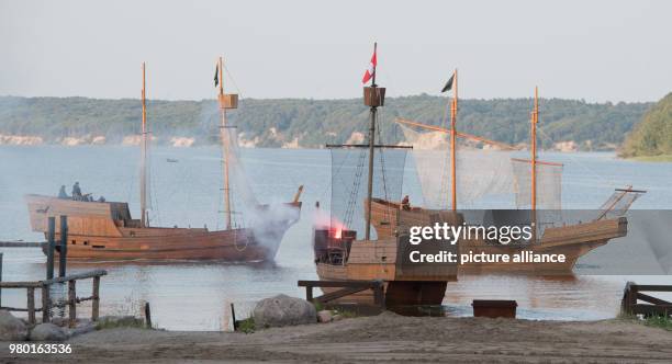 June 2018, Germany, Ralswiek: A naval battle with medieval cogs can be seen at a press screening on the Jasmund bay on the island Ruegen at the...