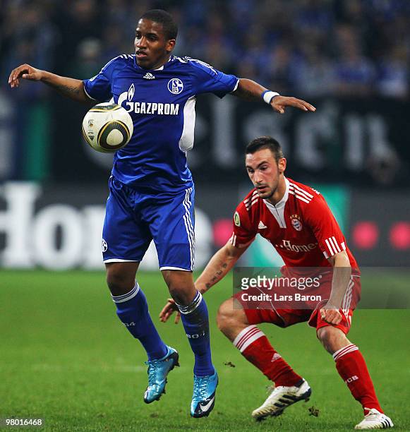 Jefferson Farfan of Schalke and Diego Contento of Muenchen battle for the ball during the DFB Cup semi final match between FC Schalke 04 and FC...
