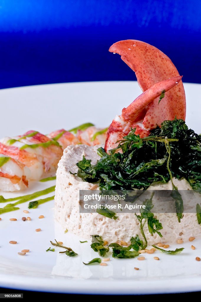 Tuna and anchovy mousse with lobster and parsley vinaigrette.