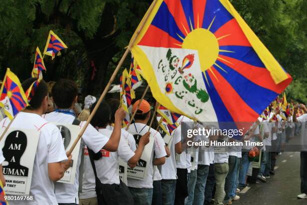 Tibetan students rally for an appeal to the United Nations against the forceful intermarriage of Tibetan and Chinese and the control over birth of...