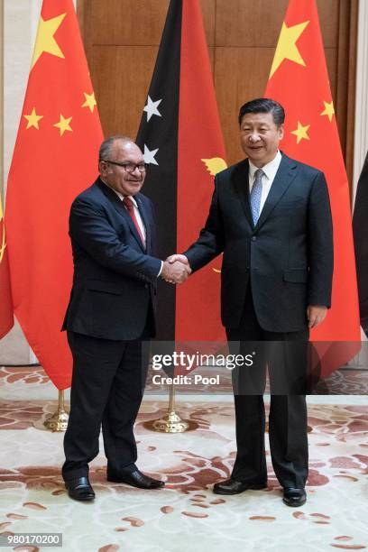 Papua New Guinea Prime Minister Peter O'Neill meets China's President Xi Jinping at the Diaoyutai State Guesthouse on June 21 Beijing, China.