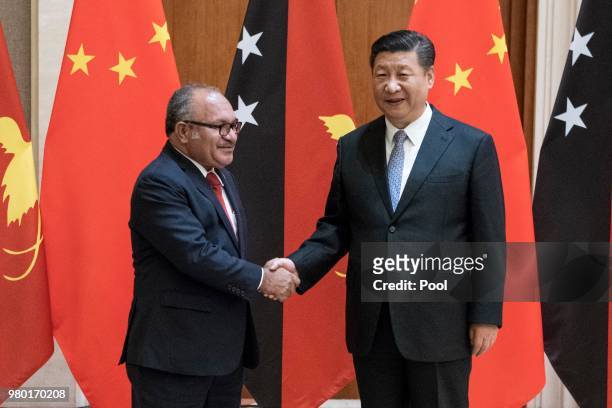 Papua New Guinea Prime Minister Peter O'Neill meets China's President Xi Jinping at the Diaoyutai State Guesthouse on June 21 Beijing, China.