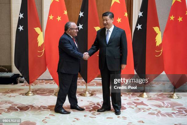 Papua New Guinea Prime Minister Peter O'Neill meets China's President Xi Jinping at the Diaoyutai State Guesthouse on June 21 Beijing, China.