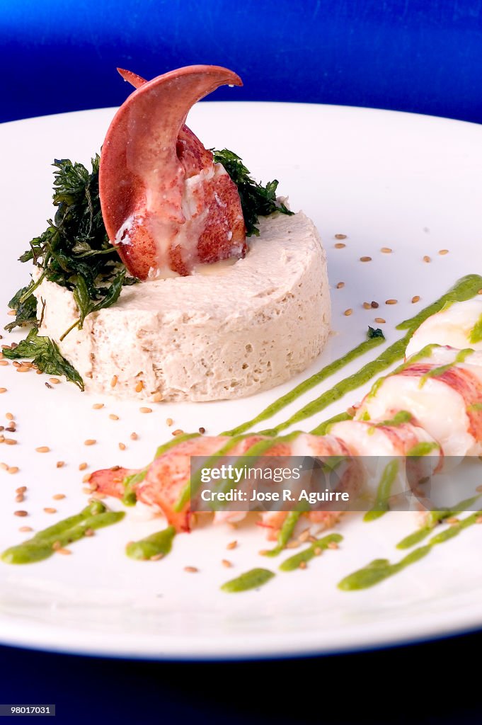 Tuna and anchovy mousse with lobster and parsley vinaigrette.