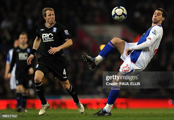 Blackburn Rovers' Croatian forward Nikola Kalinic controls the ball away from Birmingham City's English midfielder Lee Bowyer during their English...