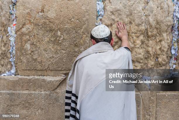 Israel, Jerusalem - 28 december 2017: Orthodox jewish man praying at the wailing wall - kotel