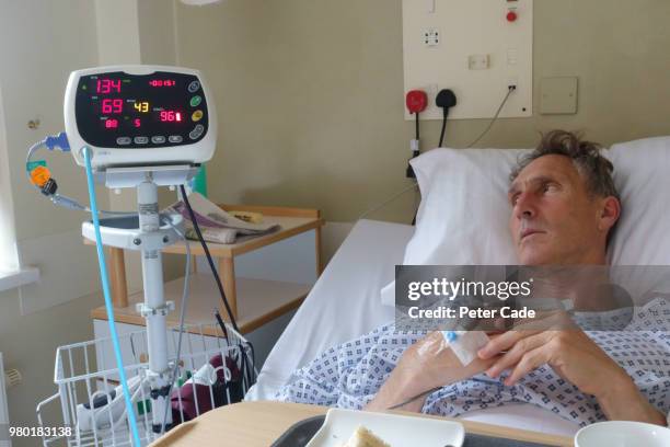 man in hospital bed - monitoring equipment stock pictures, royalty-free photos & images