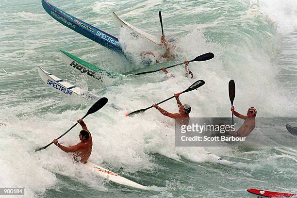 Competitors race into the surf during the ski competition at the 2001 New South Wales Surf LifeSaving Championships held at South Maroubra Beach,...