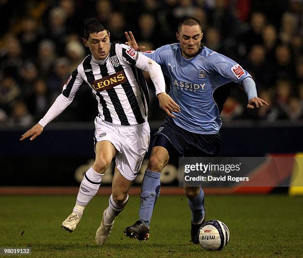 Graham Dorrans of West Bromwich is challenged by James McPake during the Coca-Cola Championship match between West Bromwich Albion and Coventry City...