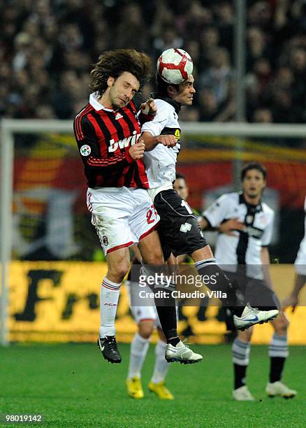 Luis Jimenez of Parma FC competes for the ball with Andrea Pirlo of AC Milan during the Serie A match between Parma FC and AC Milan at Stadio Ennio...