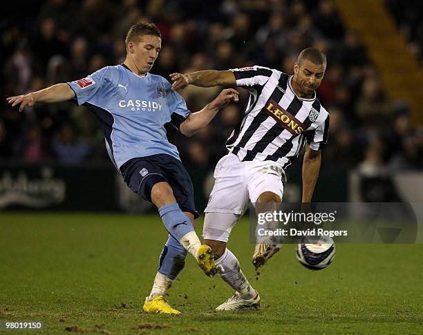 Freddy Eastwood of Coventry City is challenged by Steven Reid during the Coca-Cola Championship match between West Bromwich Albion and Coventry City...