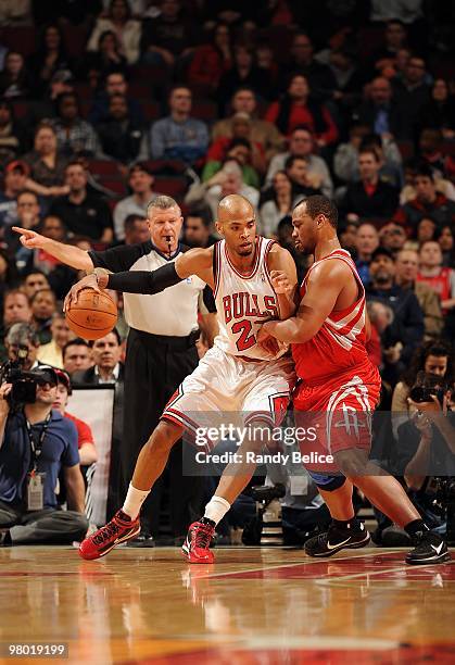 Taj Gibson of the Chicago Bulls posts up against Chuck Hayes of the Houston Rockets during the game on March 22, 2010 at the United Center in...