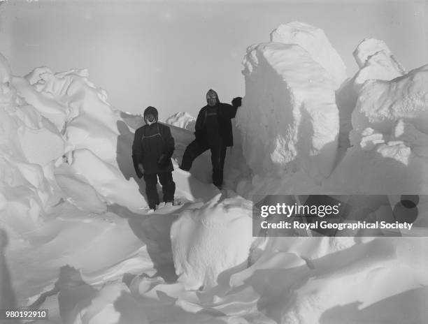 Ernest Shackleton and Frank Wild scouting for a path to the land through the hummocks, Antarctica, 1914. Imperial Trans-Antarctic Expedition...