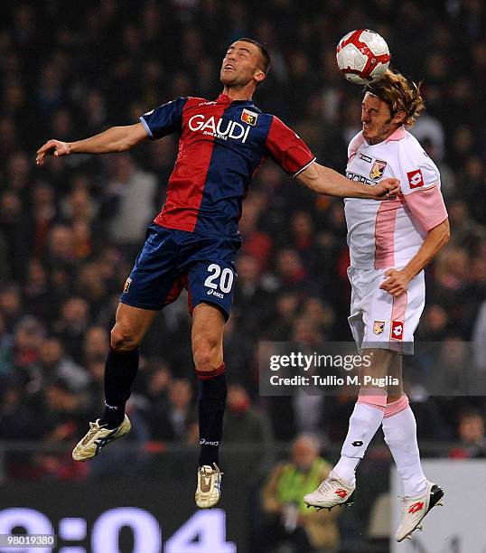 Giandomenico Mesto of Genoa and Federico Balzaretti of Palermo compete for a header during the Serie A match between Genoa CFC and US Citta di...