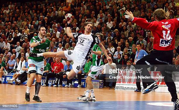 Marcus Ahlm of Kiel jumps with the ball during the Handball Bundesliga match between Frisch Auf Goeppingen and THW Kiel at the EWS Arena on March 24,...