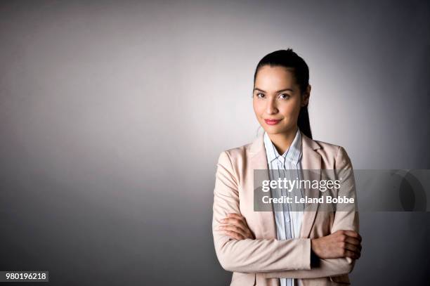 studio portraits of hispanic woman with long dark hair - leland bobbe foto e immagini stock