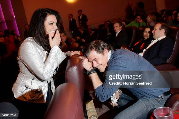 Actress Christine Neubauer and actor Sven Martinek make fun while attending the premiere of 'Haltet Die Welt an' at cinema Astor Film Lounge on March...