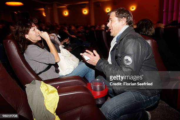 Actress Carolina Vera Squella and actor Sven Martinek make fun while attending the premiere of 'Haltet Die Welt an' at cinema Astor Film Lounge on...