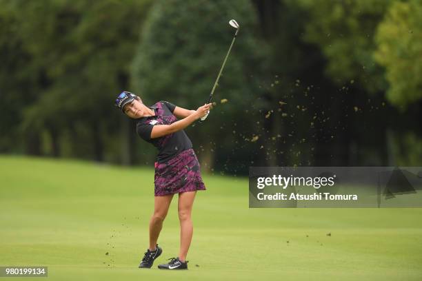 Asako Fujimoto of Japan hits her second shot on the 2nd hole during the first round of the Earth Mondahmin Cup at the Camellia Hills Country Club on...