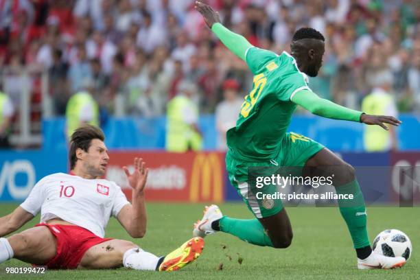 June 2018, Russia, Moscow: World Cup 2018, Poland vs. Senegal, Group H at the Spartak stadium. Poland's Grzegorz Krychowiak and Senegal's M'Baye...